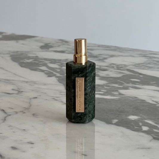 Luxury natural extrait de parfum in a serpentine atomiser by Aquilaria Port