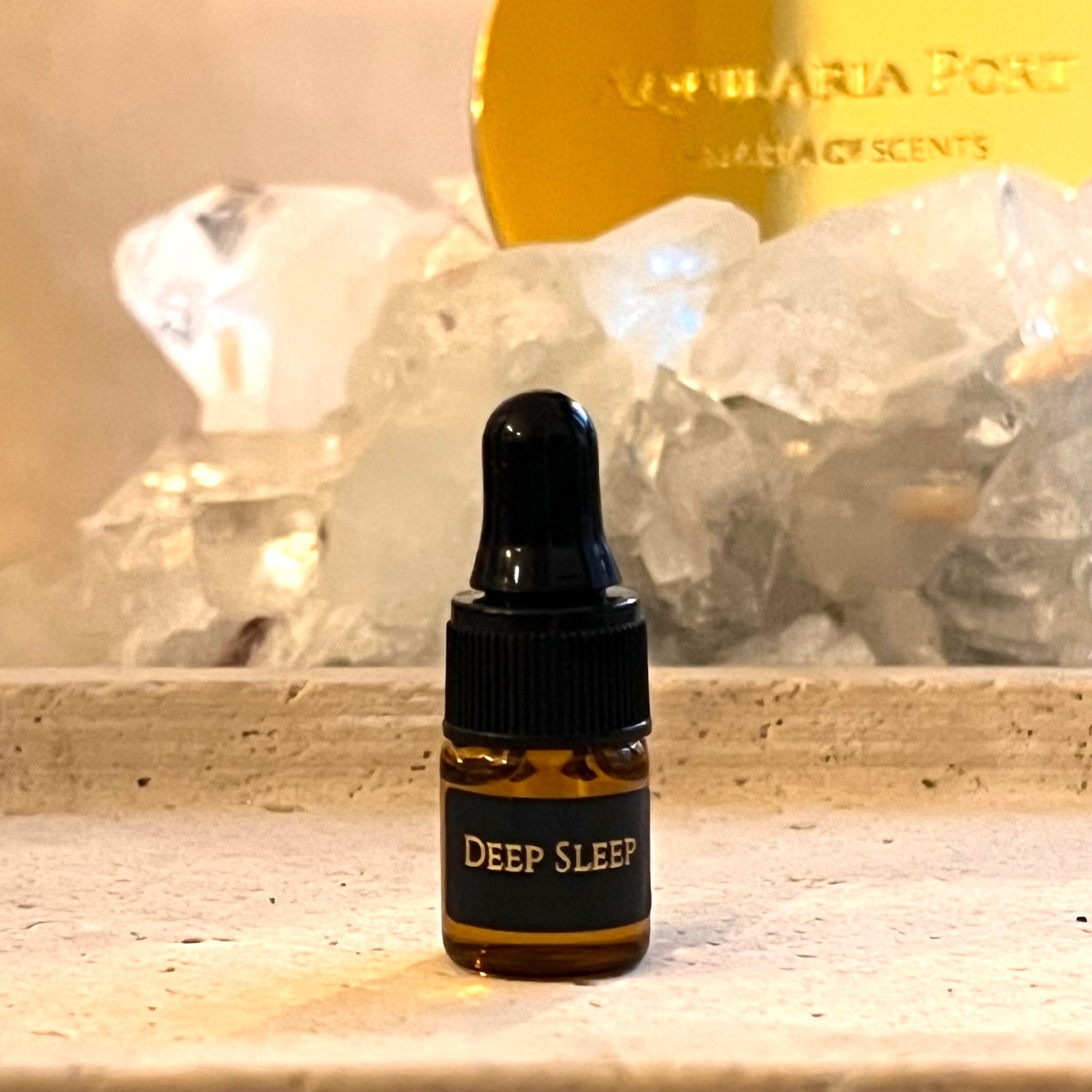 Small bottle labeled 'Deep Sleep' with a decorative background featuring crystals and a gold plaque.