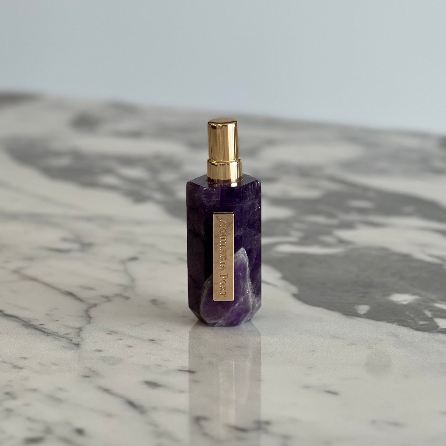 Luxury natural extrait de parfum in an amethyst atomiser by Aquilaria Port