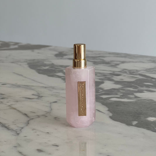Luxury natural extrait de parfum in a pink quartz atomiser by Aquilaria Port