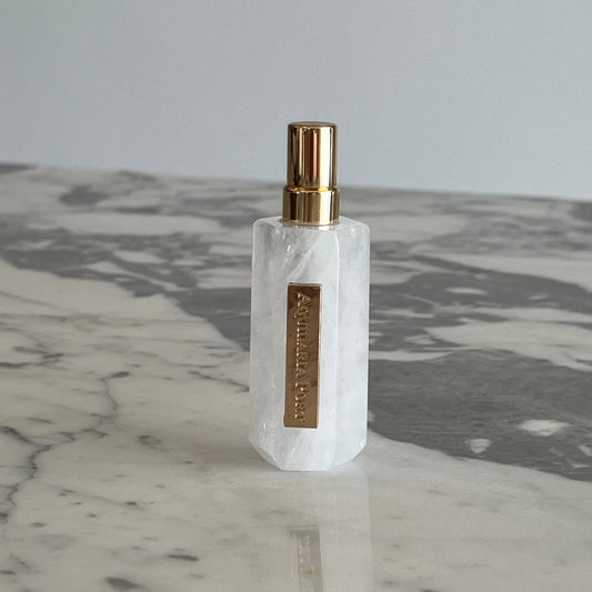 Luxury natural extrait de parfum in a white quartz atomiser by Aquilaria Port