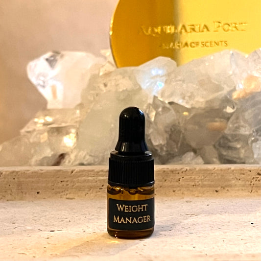 Bottle labeled 'Weight Manager' with crystals and a gold container in the background